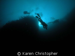 Divers descend one of the walls off Laguna Beach resort i... by Karen Christopher 
